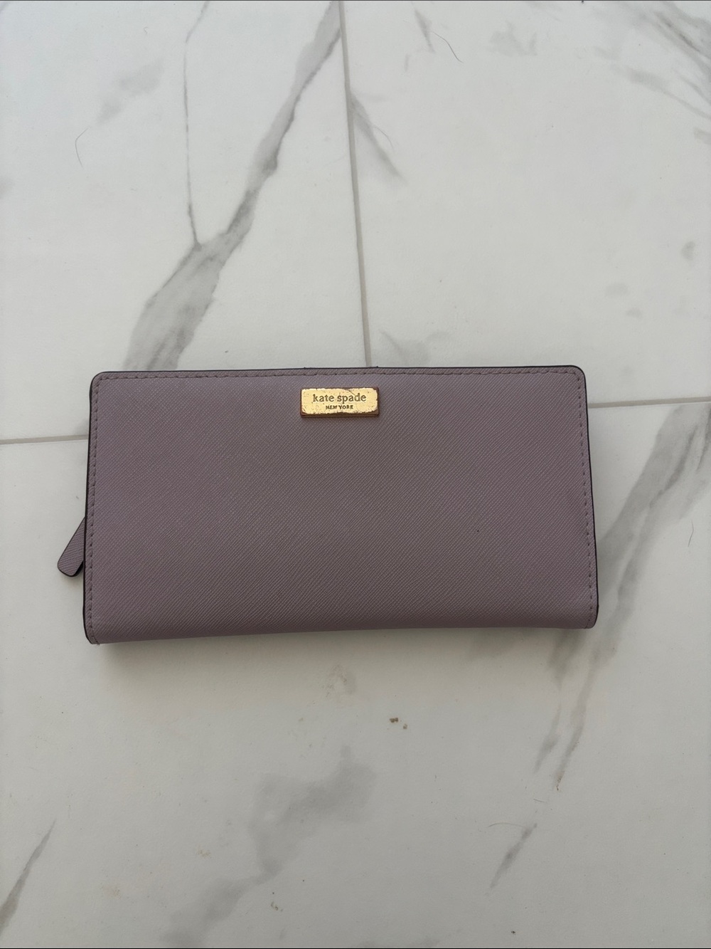 kate spade mauve zip-around leather wallet with gold plaque